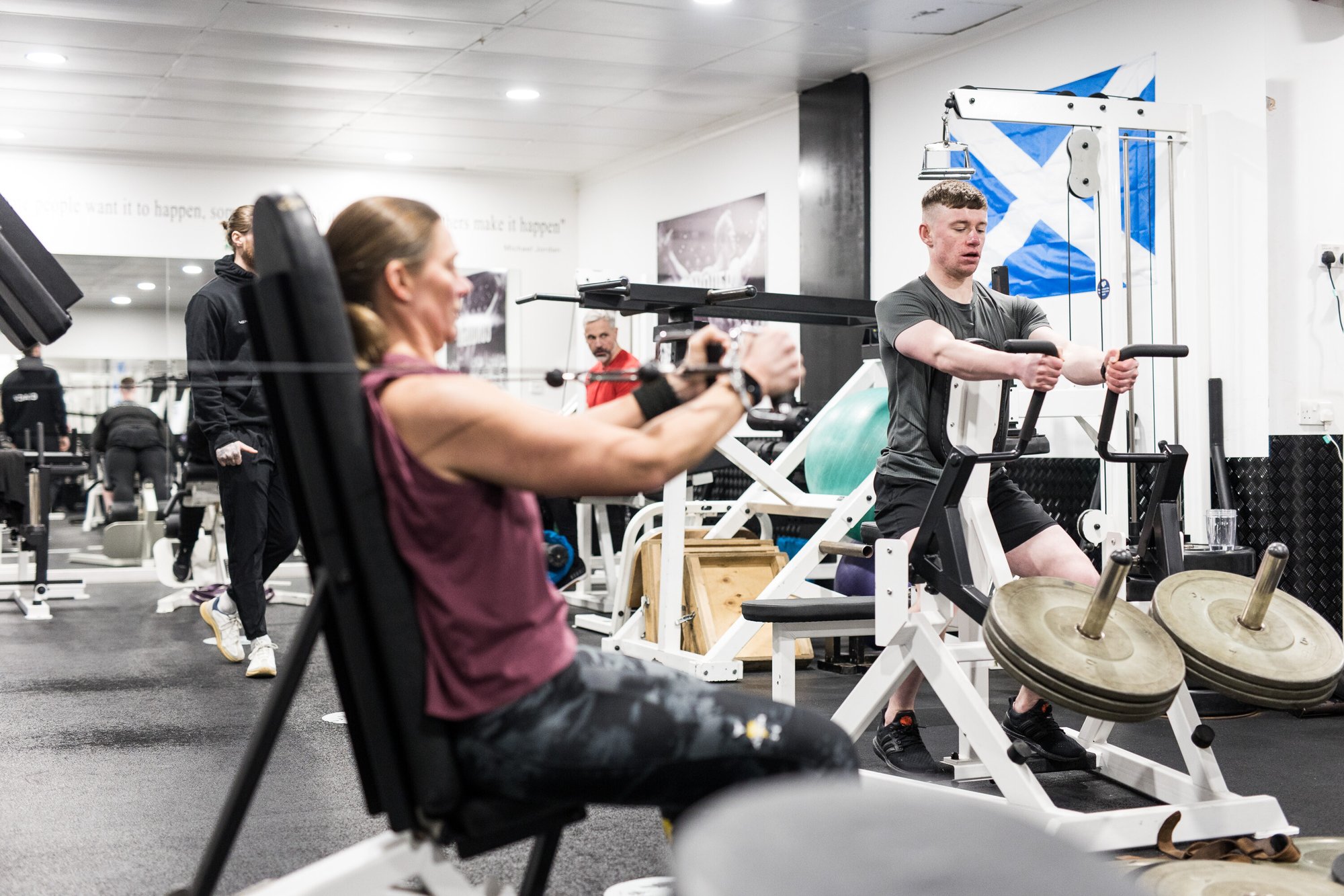 man and woman training upper body in the gym 