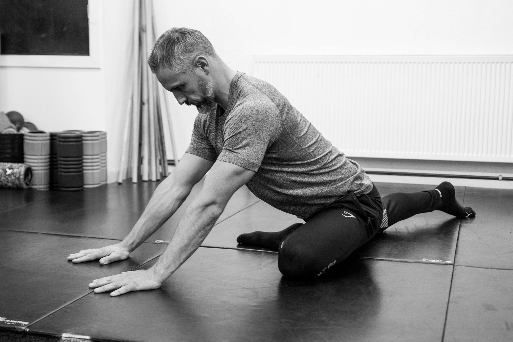 man doing a yoga stretch